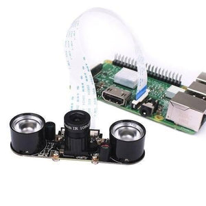 Night Vision 5MP Camera Module For Raspberry Pi With 2 IR LEDS - shown connected to a green Raspberry Pi circuit board via a white ribbon cable.