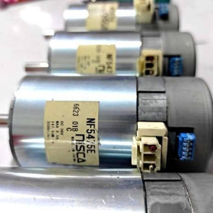 Nisca Servo DC Motor With Encoder NF5475E DC 24V To 38V And 3500 To 5000RPM - a close-up showing three silver cylindrical motors stacked vertically, each with a white power connector and blue encoder port.