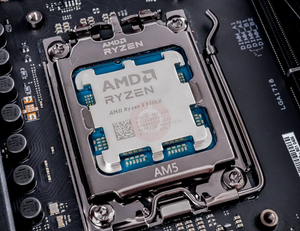 On Demand AMD Ryzen R5 9600X Processor 6 cores and 12 threads - installed in an AM5 motherboard socket, showing the metal heat spreader with engraved branding and text.