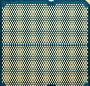 On Demand AMD Ryzen R5 9600X Processor 6 cores and 12 threads - a close-up view of the golden contact pads on the underside of the square CPU chip.