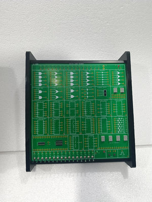 On Demand DLD Trainer Digital Logic Trainer WWW.DIGILOG.PK - a green, rectangular circuit board featuring various logic gates, toggle switches, and LED displays.