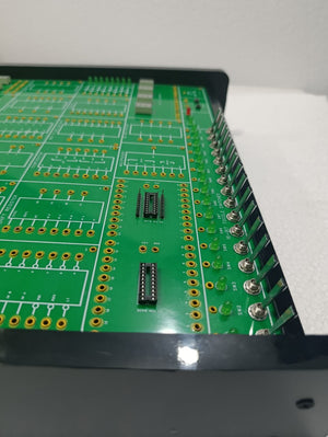 On Demand DLD Trainer Digital Logic Trainer WWW.DIGILOG.PK - a close-up of the green circuit board featuring 16-bit toggle switches and multiple pin base connectors.