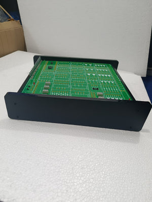 On Demand DLD Trainer Digital Logic Trainer WWW.DIGILOG.PK - a green rectangular circuit board with multiple integrated circuit sockets and ports in a black frame.