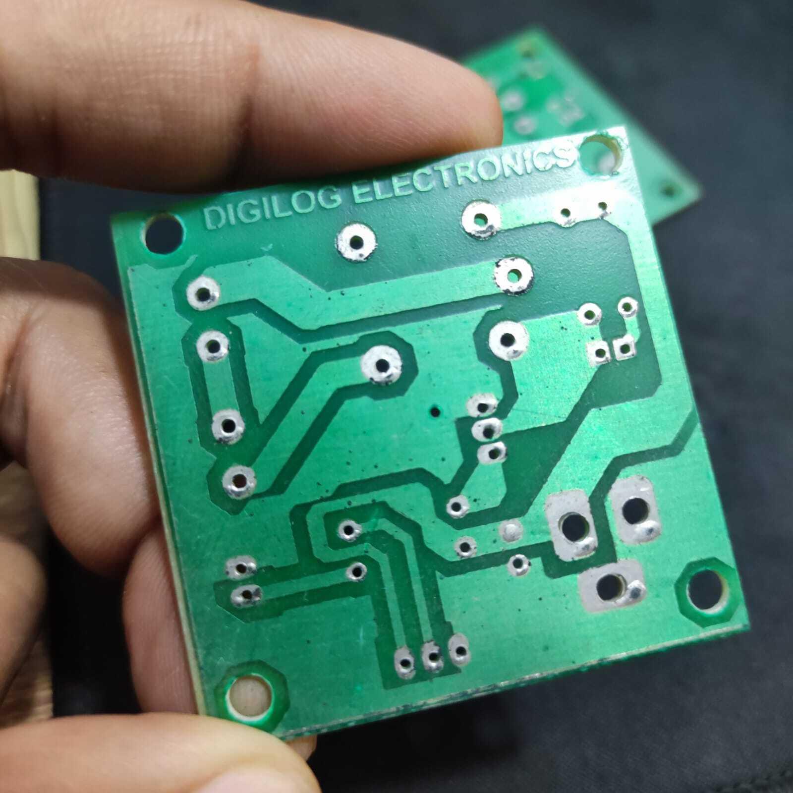 Only PCB For DIY PIR Motion Sensor Switch - a square green printed circuit board with exposed copper solder pads and the text DIGILOG ELECTRONICS.