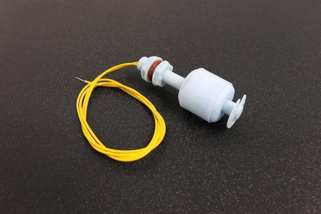 P45 Vertical Mount Float Switch For Water Level Sensing - a white plastic liquid level sensor with an orange O-ring, a threaded mounting base, and attached yellow wires.