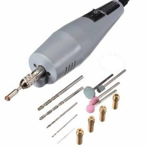 PCB Electric Drill Grinder Machine Kit - a grey handheld electric drill with a power switch, accompanied by various drill bits, grinding stones, and collets.