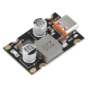 PD 65W Fast Charging Module Type C Interface Fast Charging Adapter Board DC8 to 32V Charging Protection - a black circuit board featuring a USB Type-C port, two cylindrical capacitors, and a square inductor.