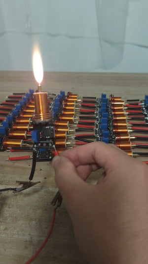 Plasma Arc Fire Head High-Frequency Electric Flame 15–24V Plasma Ignition Module-digilog.pk - a hand holding the black circuit board with a glowing plasma arc.