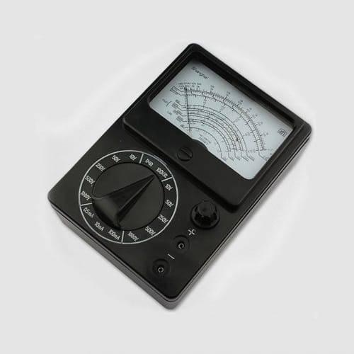 Pocket Size Analog Multimeter MF15 Digital Avometer Universal Meter - a black, rectangular device featuring a central rotary selector knob, a needle display, and two circular ports.