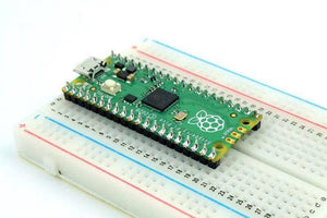 Pre Soldered Raspberry Pi Pico RP2040 Microcontroller With USB Cable - shown mounted on a white breadboard, featuring a green circuit board, USB port, and BOOTSEL button.