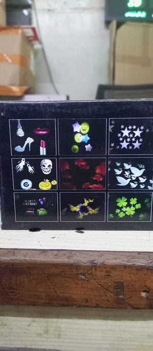 Projector - Projector packaging box showing a grid of nine different light projection patterns including stars, butterflies, skulls, and birthday themes.