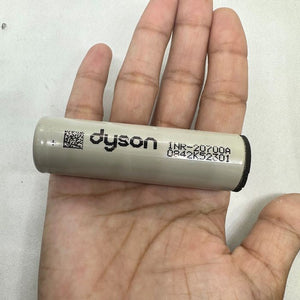 Pull-out Original Lithium Ion Cell 3.7V 3000mAh Li Ion Battery Cell INR-20700A - a cylindrical light-grey battery held in a palm, printed with "dyson" and "INR-20700A" text and a QR code.