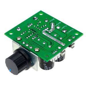 PWM Controller DC Motor Speed Controller 12V-40V 10A - a green circuit board with a black rotary knob, two black capacitors, and labeled connection points.