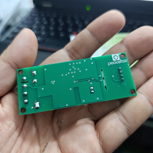 PZEM-004T 100A Single Phase Power Energy Meter Module - shown from the back, featuring a green rectangular PCB with visible solder points and connectors.