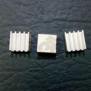 Raspberry Pi 3 Heatsink Cooler Pure Aluminum - three small square silver aluminum heatsinks, one with an adhesive backing visible.