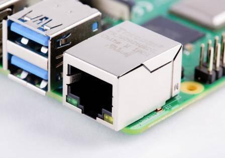Raspberry Pi 4 1GB RAM - a close-up view of the metallic Ethernet port and blue USB 3.0 ports on the green circuit board.