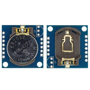 Real Time Clock DS1307 Ds 1307 RTC I2c Module AT24C32 - two blue circuit boards, one with a CR2032 lithium battery installed and one with an empty holder.