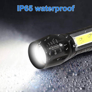 Rechargeable COB Light Flashlight - a black metal flashlight with a bright lens and a zoom control ring marked with X1, X250, X500, X1000, and X2000.
