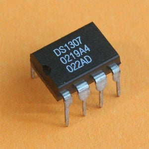 RTC DS1307 IC Real Time Clock - a black 8-pin dual in-line package electronic component with white text printed on its top surface.
