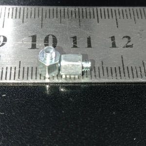 Screw Standoffs Spacers M3 Male x M3 Female - shown as a close-up of two silver hexagonal metal spacers placed against a steel ruler for scale.