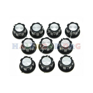 Screw Type Tightening Knob For Potentiometer - a collection of ten black plastic knobs with silver circular tops arranged in three rows.