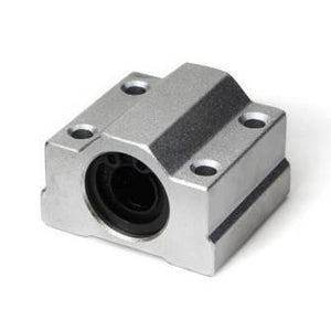 Scs8uu 8mm Linear Motion Ball Bearing Machinery Slide Bushing CNC - a silver-colored rectangular metal block with four mounting holes and a central circular opening containing a bushing.