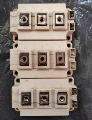 Semikron 300A Infineon FF300R12KT4 IGBT Module, 1200 V | Digilog.pk - three stacked beige rectangular power modules with numbered terminals and side-mounted connectors.
