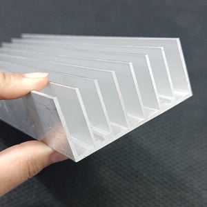 Solar Inverter Heat Sink 8 inch for 8 IGBT - a close-up of a silver-colored aluminum heat sink with multiple parallel fins held by a hand.