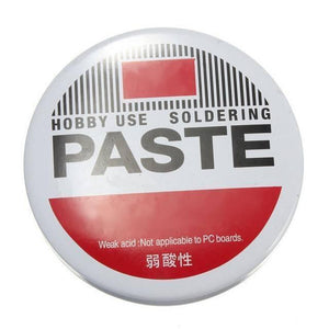 Soldering Paste - round white metal tin with red and black text, including the warning that it is weak acid and not applicable to PC boards.
