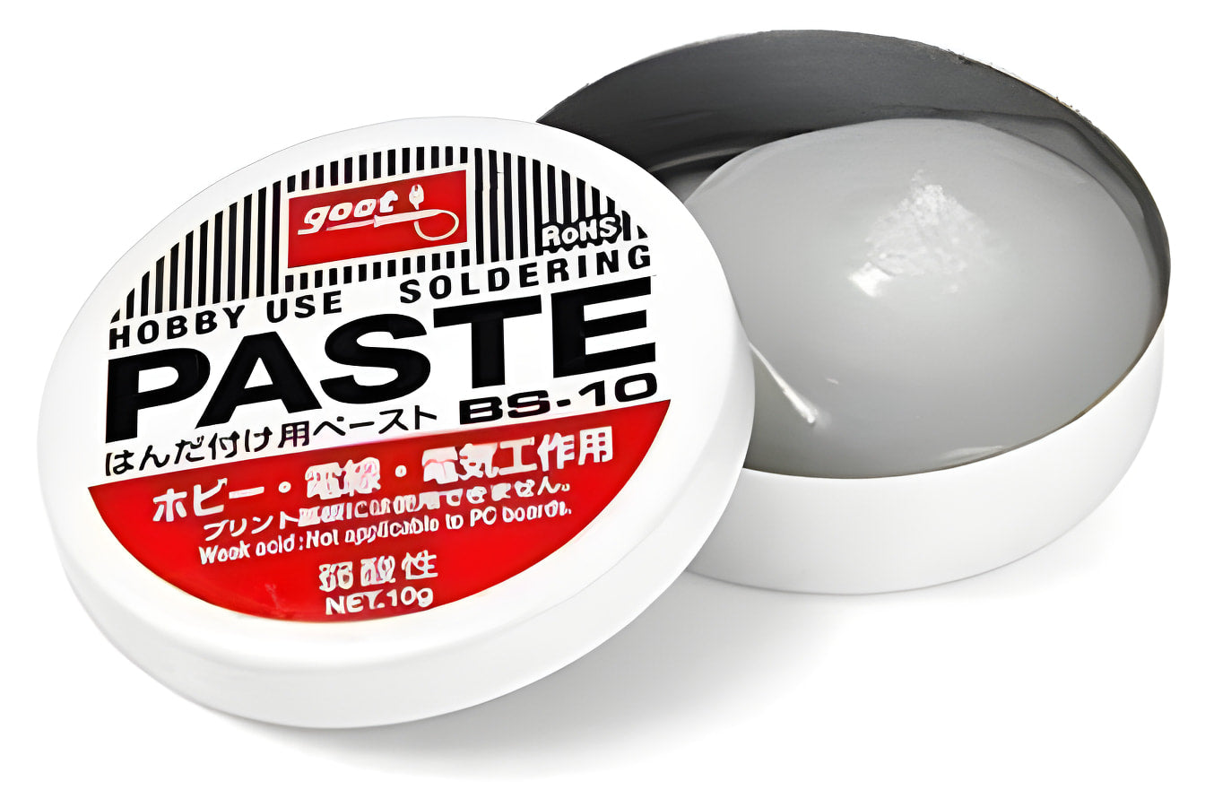Soldering Paste High Quality - shown as a white circular tin with a removed lid, revealing the grey paste inside and the product label on the cover.