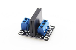 Solid State Relay Ssr Module 1 Channel For Arduino - a black relay on a black PCB with two blue screw terminal blocks and three input pins.