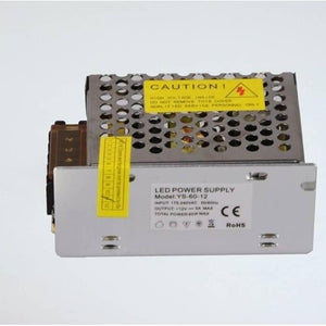 Switching Power Supply SMPS 12V 5A - a silver metal-cased unit with a yellow caution label and a white specification sticker on the front face.