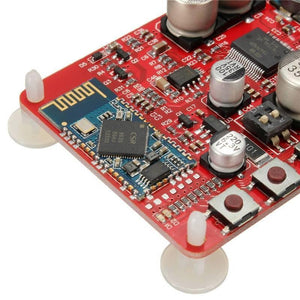 TDA7492 12V 24V 50W + 50W Wireless Bluetooth 4.0 Audio Receiver Board 2x50w Digital Amplifier Module - a red circuit board featuring a CSR chip, two silver capacitors, three push buttons, and a black toggle switch.