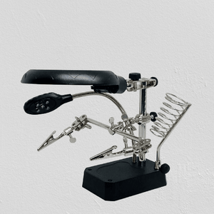 TE 800 Magnifying Glass 5 LED Auxiliary Clip Magnifier 3 In 1 Hand Soldering Solder Iron Stand Holder Station - a black base, two metal alligator clips, a magnifying lens, an LED light, and a solder stand.
