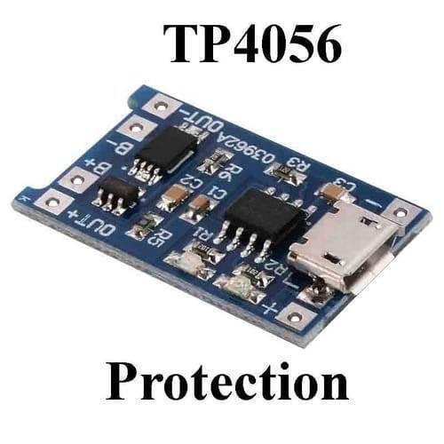 TP4056 1A Li-ion Battery Charging Board Micro USB With Current Protection BMS - TP4056 module, a blue rectangular circuit board featuring a micro USB port, two integrated circuits, and labeled connection pads for battery and output.