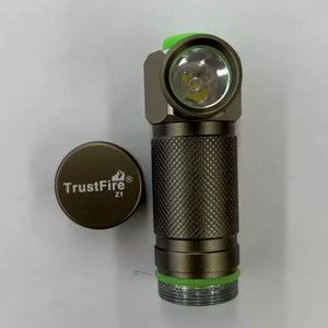 TrustFire Z1 Flashlight Cree XP-E 280 lumens 1XCR123A/16340 - shown as a metallic brown right-angle torch with a green button and a detached circular screw-on cap on a white background.