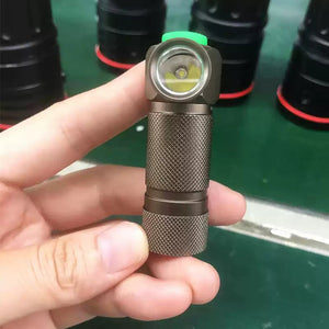 TrustFire Z1 Flashlight Cree XP-E 280 lumens 1XCR123A/16340 - a compact bronze-coloured right-angle torch held in a hand, featuring a top-mounted green button and a textured metal body.