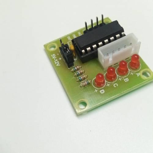 ULN2003 Stepper Motor Driver Board For Arduino Avr SMD - a green circuit board with an integrated chip, four red LEDs, a white connector, and input pins.