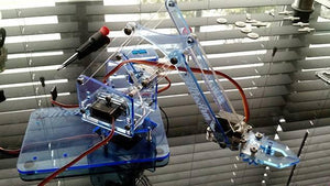 Unassembled 4dof Robotic Arm - a blue transparent acrylic mechanical arm structure with attached servo motors, sitting on a base with a small screwdriver.