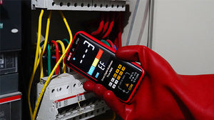 UNI-T UT121B Smart Digital Multimeter – 6000 Count Auto-Identify, True RMS, Dual Display EBTN, AC/DC 600V, 60mF Capacitance, NCV, Live Wire, CAT III 600V - held in a red-gloved hand, showing an EF mode display with a bar graph and dashed lines near electrical wiring.