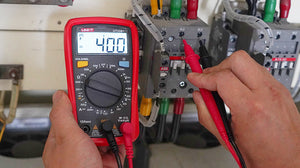 UNI-T UT33B+ Palm Size Digital Multimeter – 2000 Count, AC/DC Voltage & Current, Battery Test, Resistance, Diode & Continuity, CAT II 600V, 2m Drop-Proof - a red casing, rotary dial, display reading 400V AC, and probes measuring an electrical contactor.
