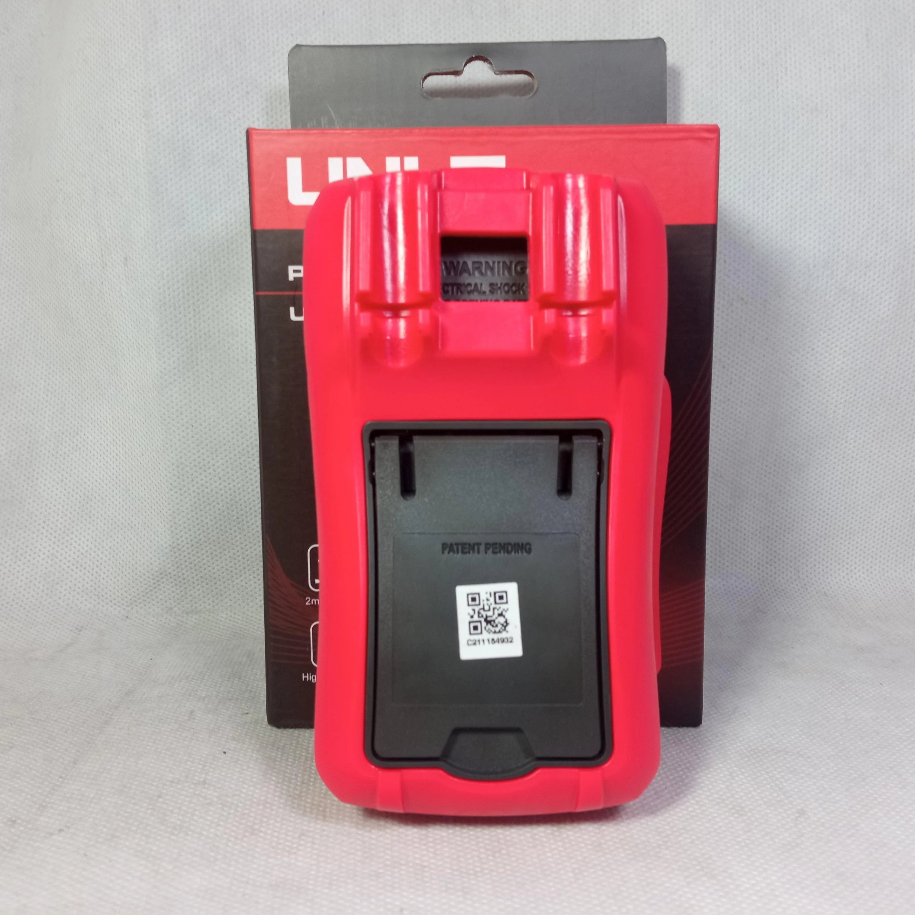 UNI-T UT33D+ Plus Digital Multimeter - rear view showing its red protective casing, a black battery compartment cover, and its original product box.