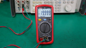 UNI-T UT39A+ Digital Multimeter – 4000 Count, AC/DC 1000V, 10A, Capacitance, hFE, NCV, Diode & Continuity, CAT II 1000V / CAT III 600V - UNI-T UT39E+ digital multimeter in a red casing with a rotary dial, showing 19.999 A on the screen with red and green test leads connected.