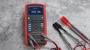 UNI-T UT714 Multifunction Temperature Process Calibrator – Thermocouple, RTD, mV, Resistance Source & Measure, 20000 Count - a red handheld device measuring 009.98 ohms with four connected test leads and a resistor.