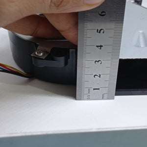 Used 24V 125mm x 125mm x 33mm 24V Turbo Blower Fan Cooling Fan - shown in a close-up view being measured with a metal ruler against its side profile.