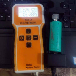 USED 26650 3.2V 3300mAh LiFePO4 Cylindrical Li-ion Batteries - being tested by an orange RC3563 battery tester showing 29.53mΩ and 3.268V on the display.