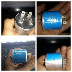 Used Noise Filter EMI Filter Anti-Interference Noise Signal Filtration Single Phase Mains Filter 125V 250V - a cylindrical blue EMI filter with four metal spade terminals, shown from multiple angles in a person's hand.
