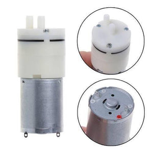Used Suction Pump 12V DC Water Pump & Air Pump - shown in a composite image with a side view, a top view, and a bottom view with two electrical terminals.