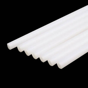 White Color 11mm Hot Melt Glue Sticks Electric Heating Adhesive Film Craft Glue Stick - a close-up of several cylindrical white adhesive sticks arranged in a row against a black background.
