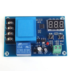 XH-M602 / XH-M633 Programable Battery Charging Control Module - Battery Charge Control Switch Protection Board - Pakistan - a blue circuit board featuring a 3-digit LED display, two push buttons, a relay, and terminal blocks.